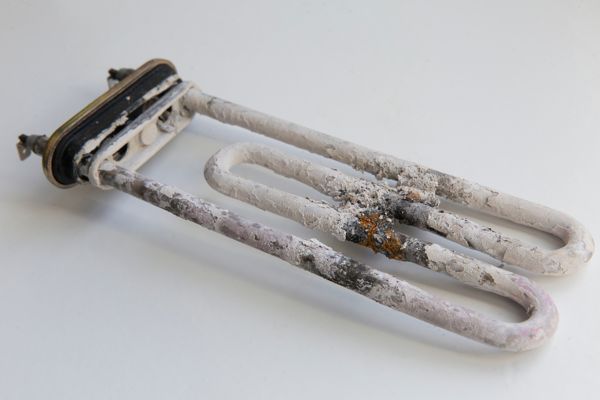 Limescale on a washing machine element